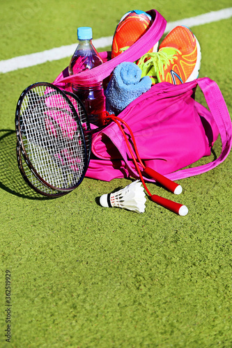 Bag with sports equipment on the sports courts background.