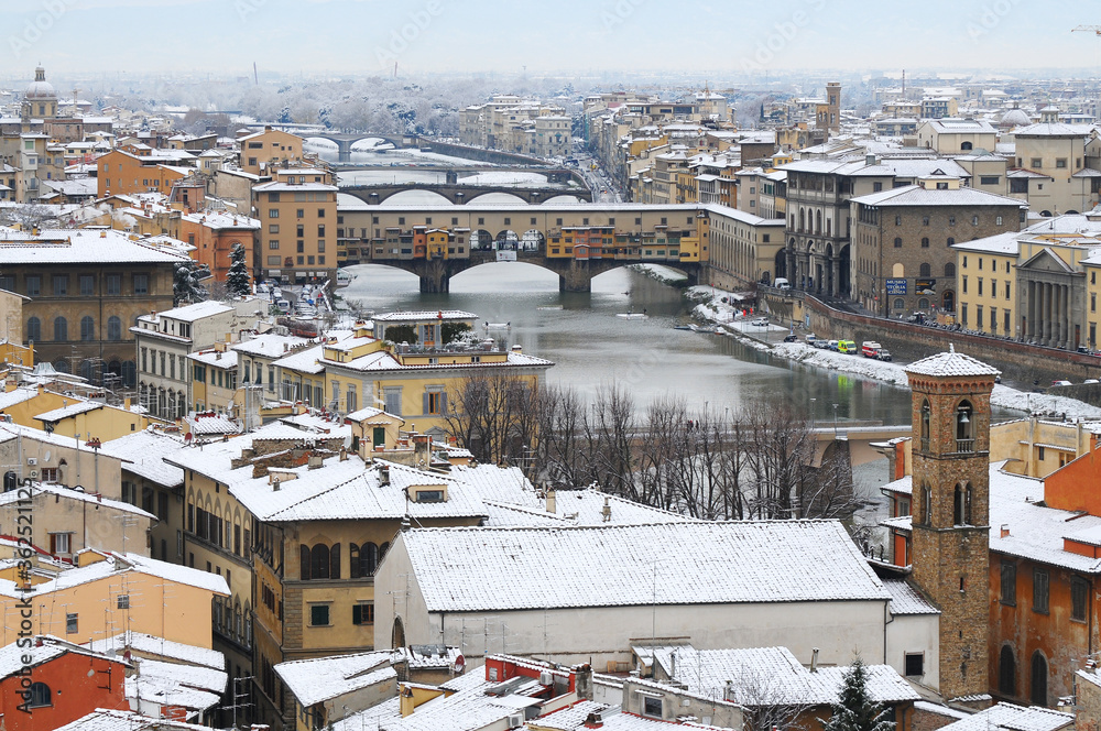 Fototapeta premium Ponte Vecchio or Old Bridge Florence Italy with snow panorama Tuscany.