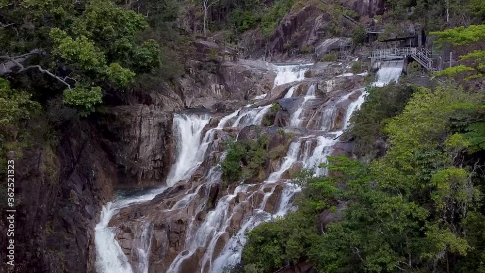 Aerial View Of Behana Gorge Falls With Water Cascading Down. Slow Dolly Forward Aerial View Of Behana Gorge Falls With Water Cascading Down. Slow Dolly Forward