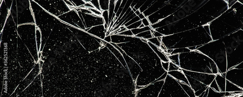 white cracks on a black glass surface, abstract, texture