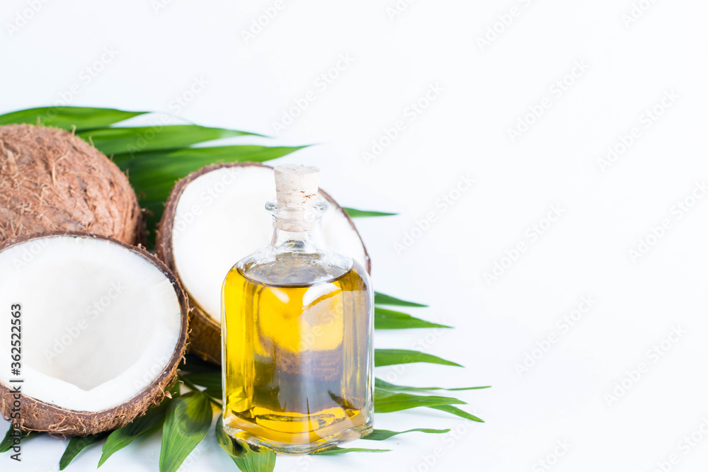 Ripe half cut coconut on a wooden background. Coconut cream and oil. Ripe half cut coconut on a wooden background. Coconut cream and oil.
