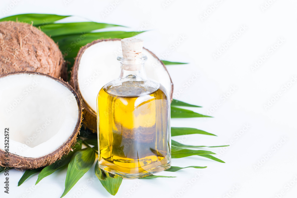 Ripe half cut coconut on a wooden background. Coconut cream and oil. Ripe half cut coconut on a wooden background. Coconut cream and oil.