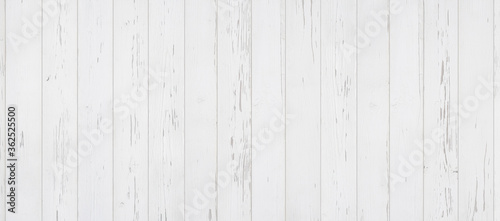 Weathered white wooden background texture. Shabby white painted wood panorama.