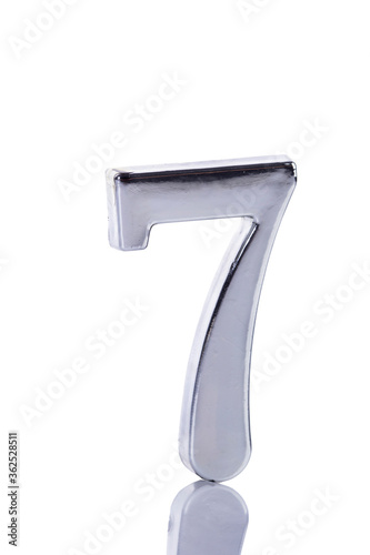 Silver metal number seven on white background