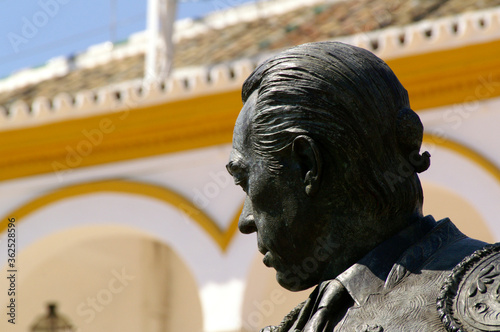 Seville (Spain). Close-up of the sculpture of the bullfighter Curro Romero next to the bullring of the Maestranza in Seville photo