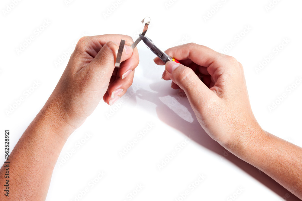Different goldsmiths tools on the jewelry workplace. Desktop for craft jewelry making with professional tools. White background. Different goldsmiths tools on the jewelry workplace. Desktop for craft jewelry making with professional tools. White background.