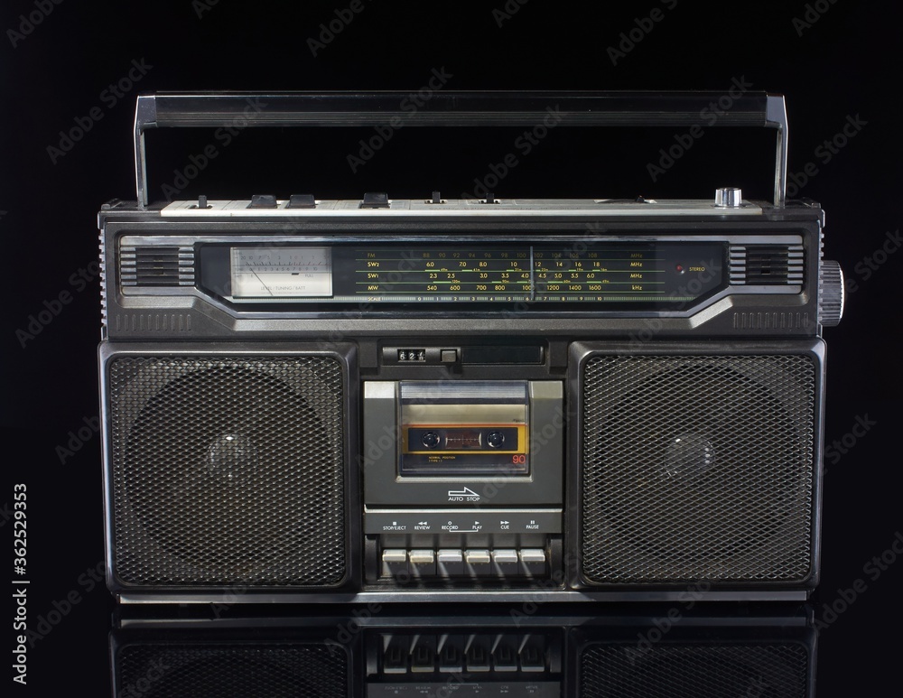 Fototapeta premium Vintage boom box on black background with reflection