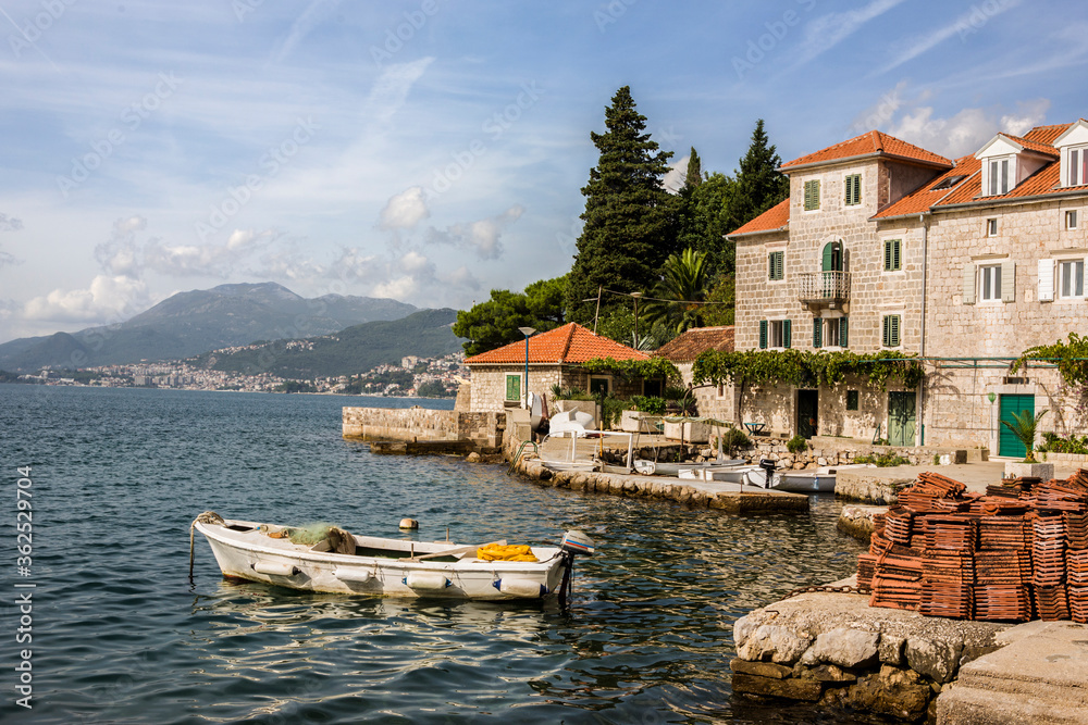Roof tiles piled on the quayside in the charming fishing village of Rose, Luštica, Montenegro