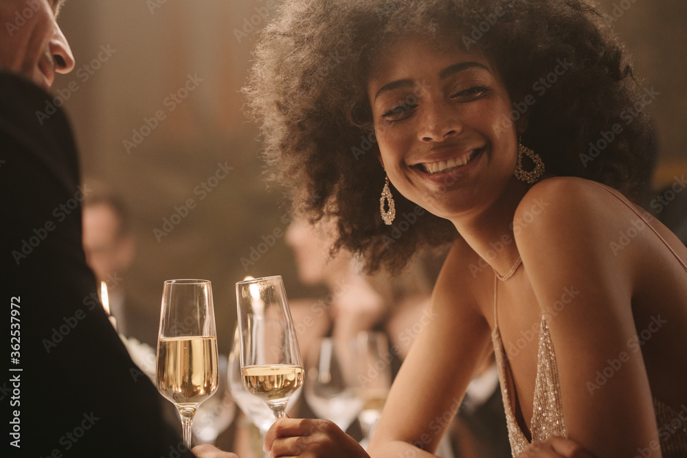 Portrait of smiling couple at dinner party
