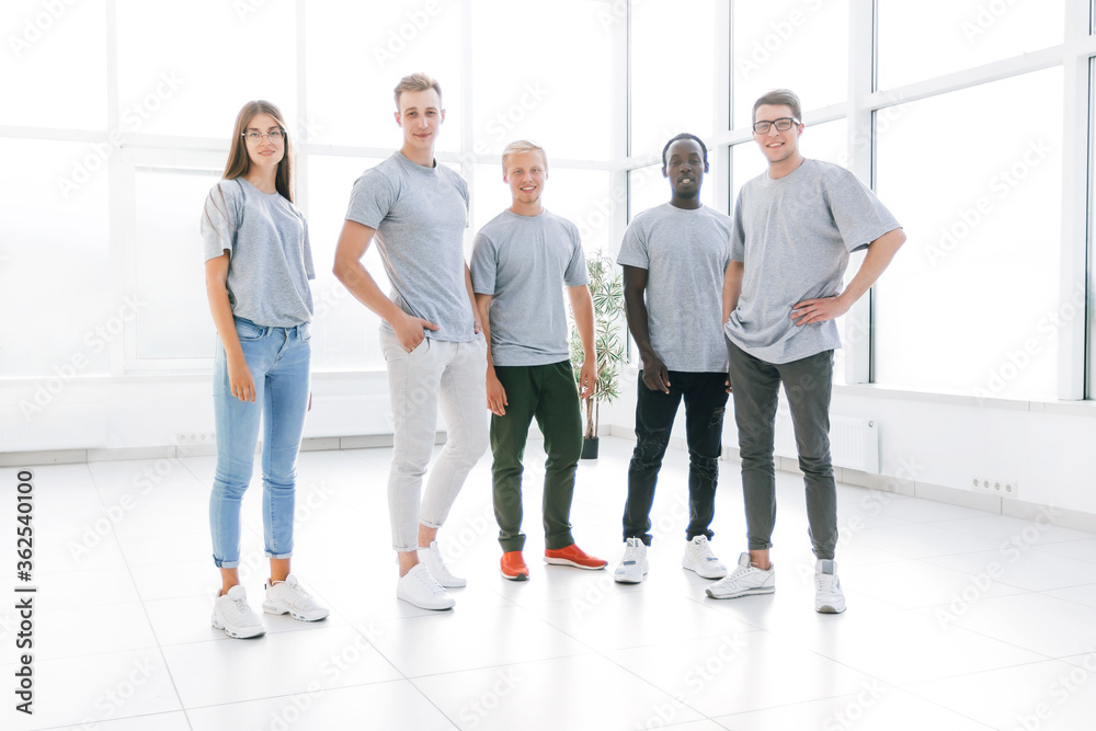 Fototapeta premium group of young people standing in an empty office.