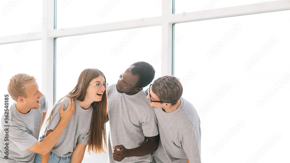 group of friends standing in a bright spacious hall group of friends standing in a bright spacious hall