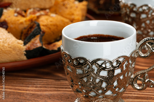 Two cups of coffee with traditional turkish desserts