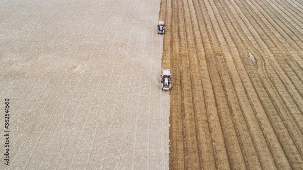 Fototapeta premium seeder sows in the field, North China