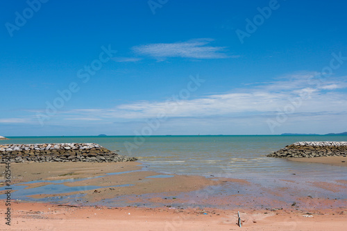 sea and beach on blue sky in summertime