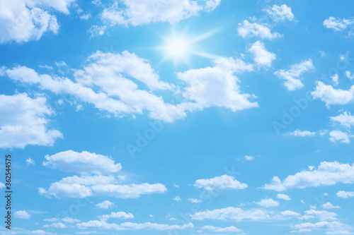 blue sky with sun and clouds background