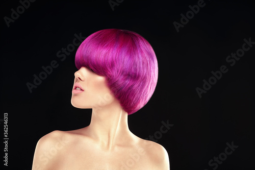 Dyed hair model portrait on black background. Pink or purple ombre short,hair style