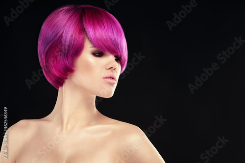 Purple Dyed hair model portrait on black background. Pink ombre short hair style model