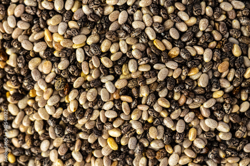 Heap of chia seeds close up for background