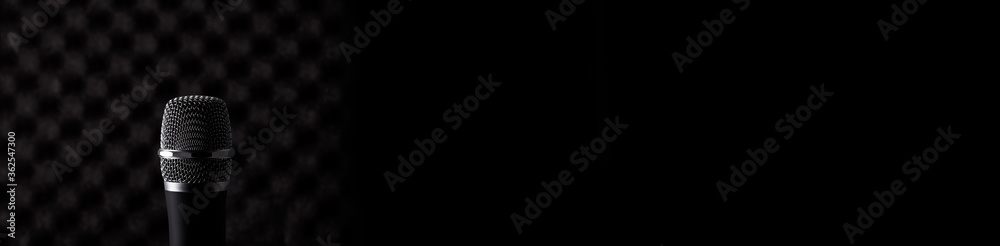 Wireless microphone closeup on foam acoustic background Wireless microphone closeup on foam acoustic background