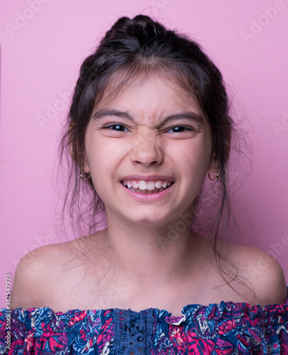 Excitement and fascination concept. Close up portrait. pink background. foolish grimaces comical crazy gesture. Funny expression.  non-verbal reaction. emotional ecpression Mock up, giggly photo