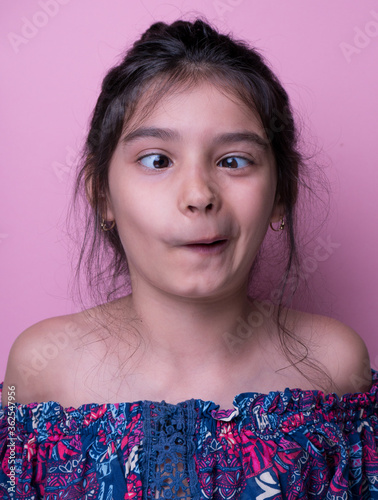 Excitement and fascination concept. Close up portrait. pink background. foolish grimaces comical crazy gesture. Funny expression.  non-verbal reaction. emotional ecpression Mock up, giggly photo