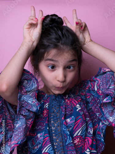 Excitement and fascination concept. Close up portrait. pink background. foolish grimaces comical crazy gesture. Funny expression.  non-verbal reaction. emotional ecpression Mock up, giggly photo