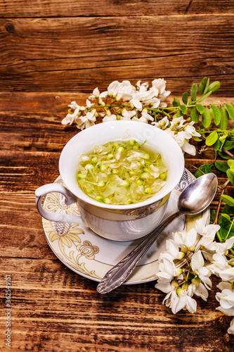 Tea from fresh acacia petals. Hot drink, alternative medicine