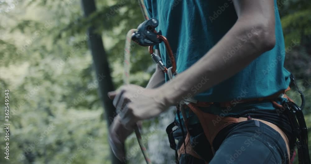 Climber protect rock climb partner pull brake by hand belay lead rope equipment safety gear for outdoors lifestyle sport in nature unrecognizable close up Climber protect rock climb partner pull brake by hand belay lead rope equipment safety gear for outdoors lifestyle sport in nature unrecognizable close up