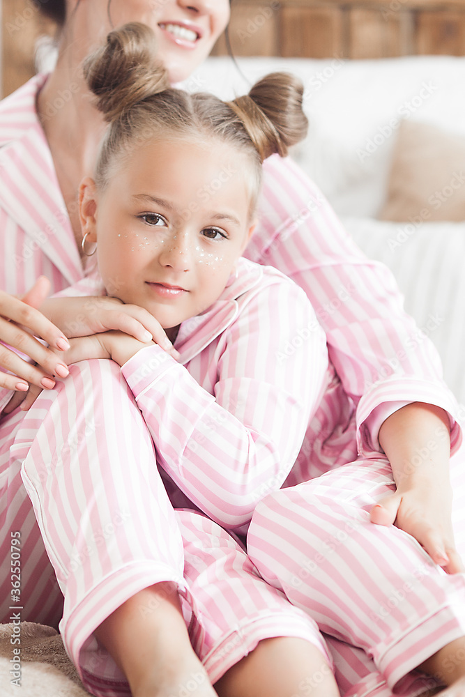 Mother and daughter sleeping. Cute child in pajamas