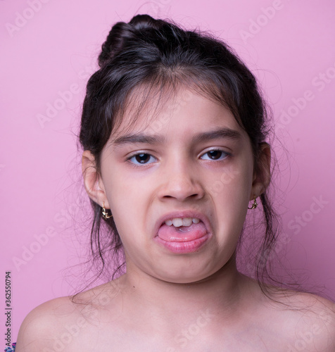 Excitement and fascination concept. Close up portrait.  actor pink background. foolish grimaces comical crazy gesture. Funny expression.  non-verbal reaction. emotional ecpression