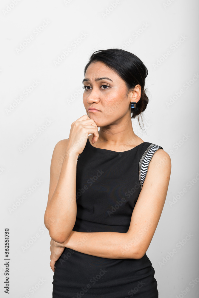 Portrait of Asian businesswoman thinking and looking away Portrait of Asian businesswoman thinking and looking away
