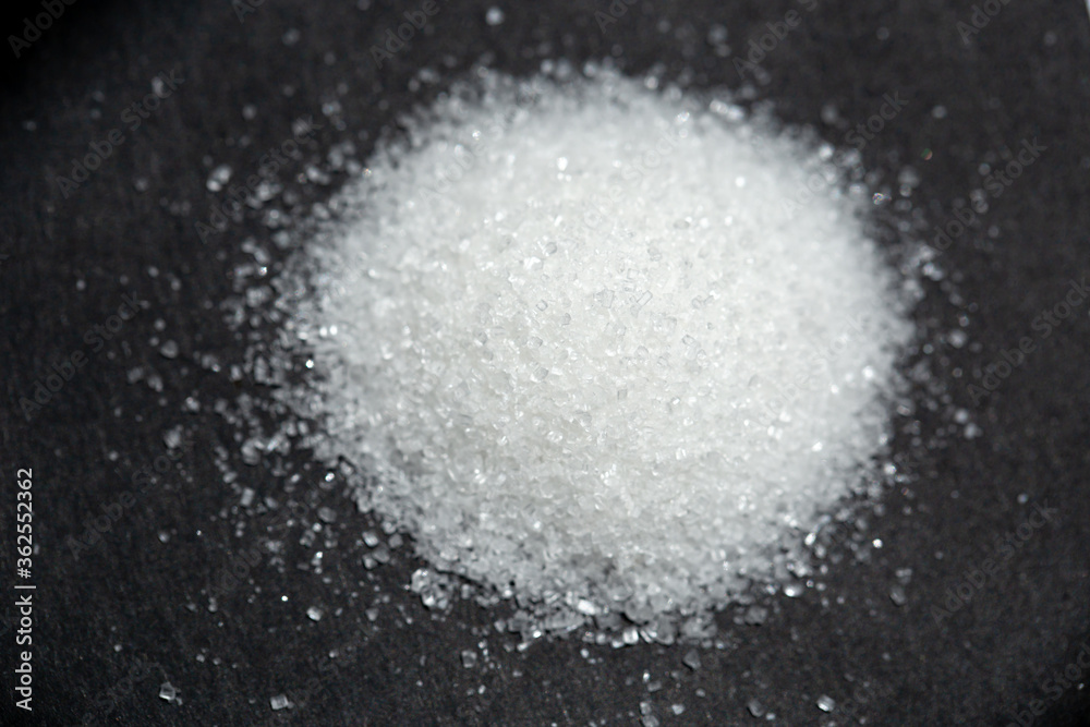 sugar on black background. selective focus sugar on black background. selective focus