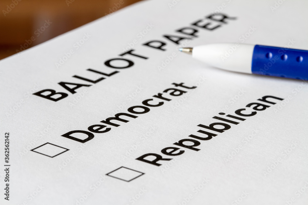 Checklist concept. Closeup of ballot paper with words Democrat and Republican with checkboxes and pen on it.