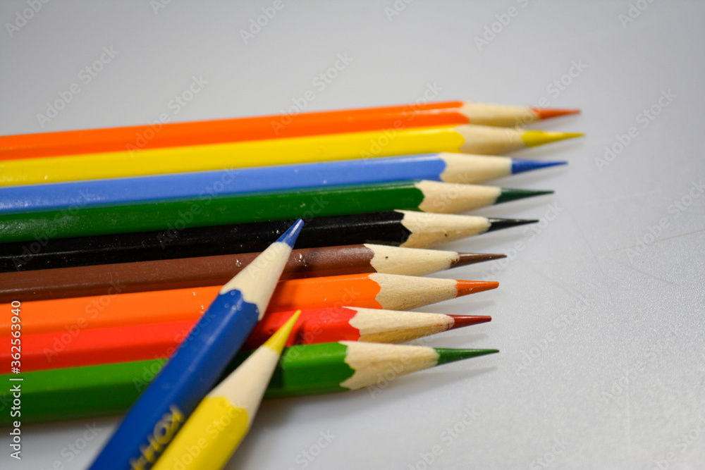 Fototapeta premium colored pencils with notebook for drawing on paper and fun