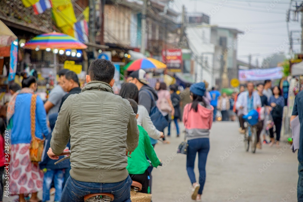 group of people walking in the city