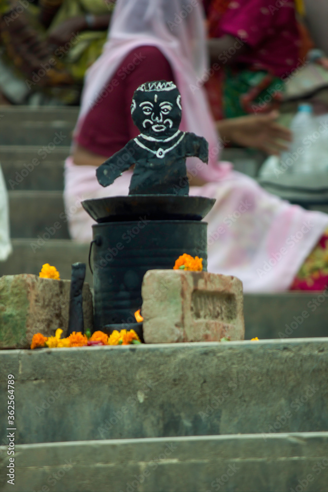 Haridwar, India - August 18, 2012: A depiction of a shani God ( Planet saturn ) used for taking donation
