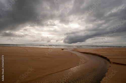 dark clouds over the sandy beach