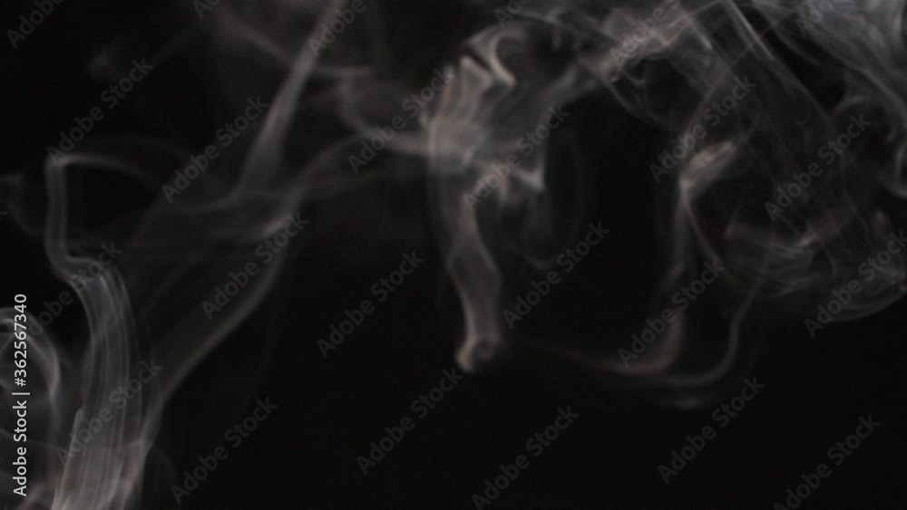 Slow motion of white abstract cigarette smoke on black background Slow motion of white abstract cigarette smoke on black background