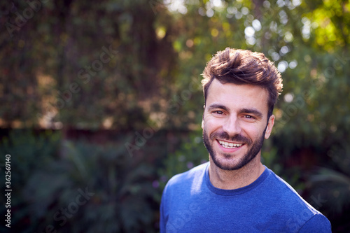 Outdoor Portrait Of Smiling Caucasian Man With Beard At Home  Relaxing At Garden Party