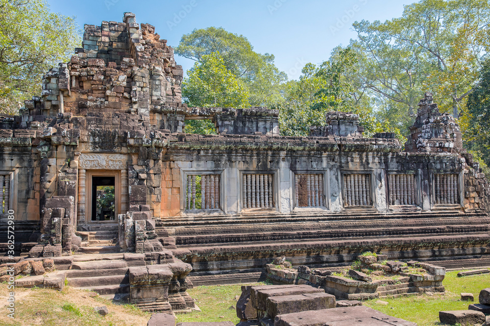 Ancient Preah Palilay temple in Angkor Thom and huge Banyan trees, Angkor, Cambodia.