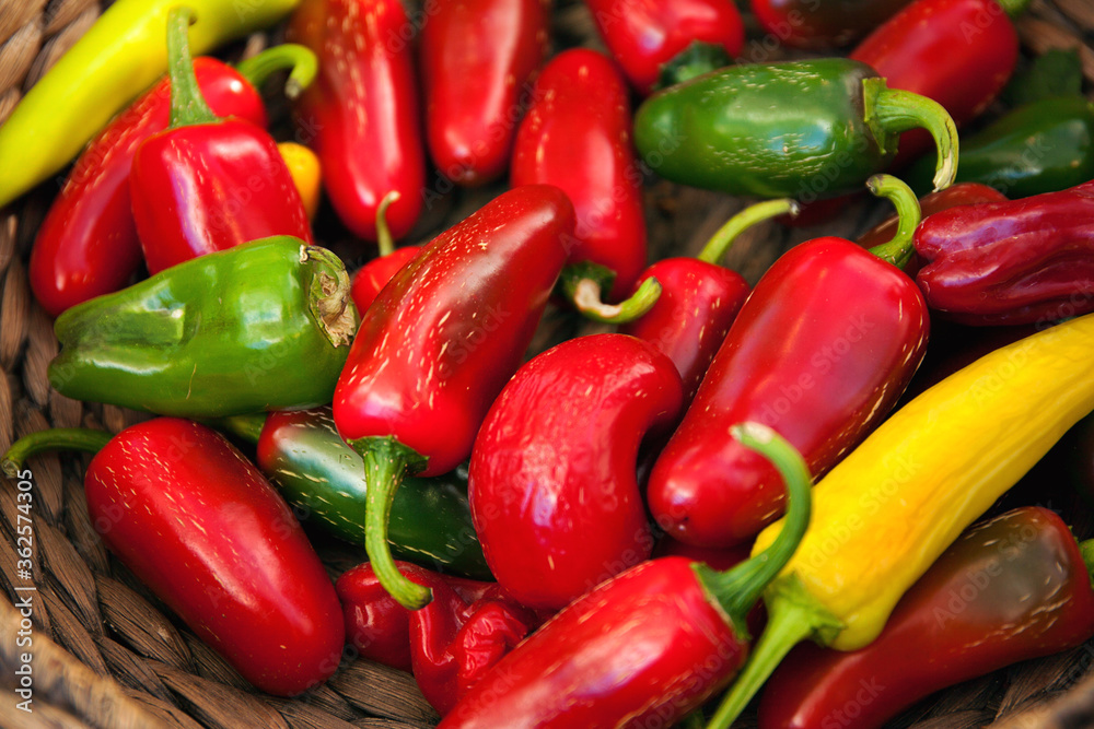 Jalapeño peppers on a wicker plate Jalapeño peppers on a wicker plate