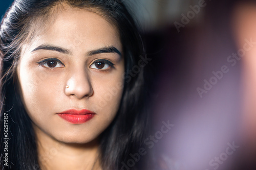 Closeup portrait of pretty young woman with makeup and smile on face.  © Abhishek Kumar Sah