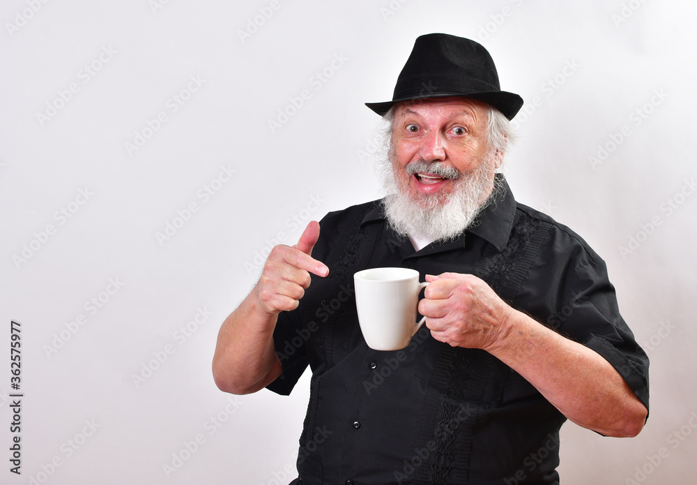 Elderly gentleman enjoying his caffeine jolt.Hipster enjoying his mug of coffee.Well dressed man getting his caffeine high Elderly gentleman enjoying his caffeine jolt.Hipster enjoying his mug of coffee.Well dressed man getting his caffeine high