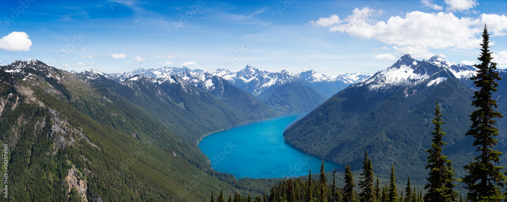 Beautiful Panoramic View of Canadian Mountain Landscape during a vibrant sunny day. Taken on a Hike to Goat Ridge in Chilliwack, East of Vancouver, British Columbia, Canada. Nature Background Panorama