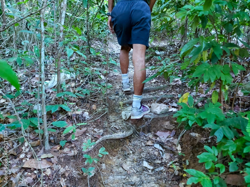 A single man walking and exercising in the woods