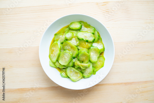 A dish of fried vegetable gourd on a table