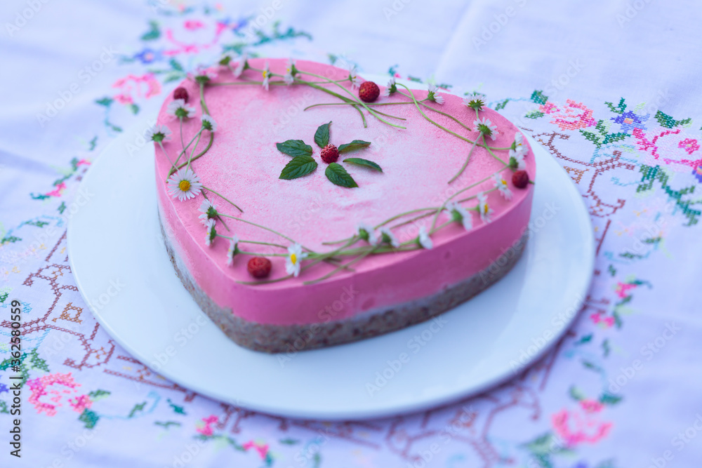 Vegan and raw strawberry cake in heart shape Vegan and raw strawberry cake in heart shape