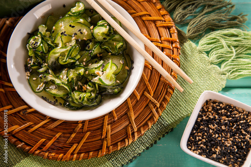 Sunomono - Japanese Cucumber Salad with sesame seeds.