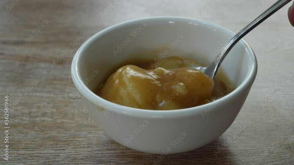 mashed potato dressing gravy sauce on cup scooping by silver spoon mashed potato dressing gravy sauce on cup scooping by silver spoon
