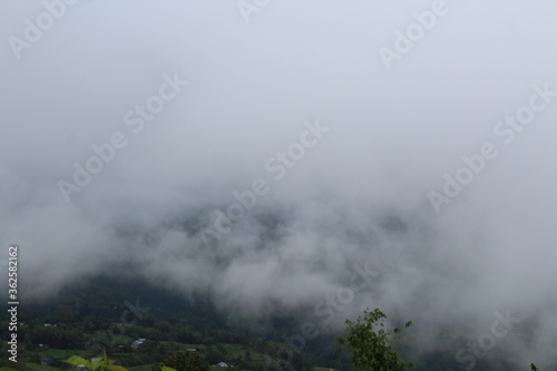 Beautiful scene of green hill with lots of lots green trees and clouds at Nepal